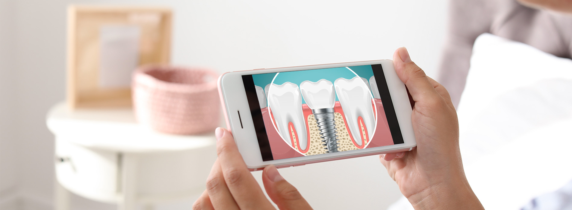 A person holding a smartphone displaying an advertisement with images of teeth.