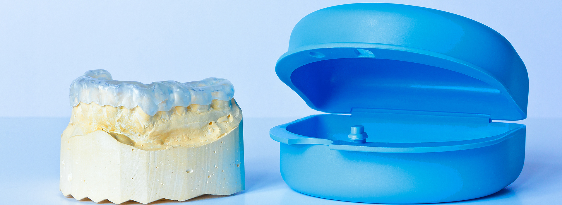 The image shows two dental implants placed next to each other on a white background, with a focus on their shape and design.